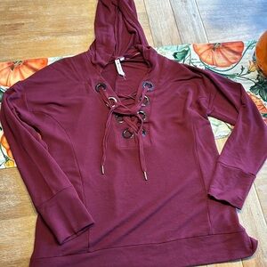 Sweatshirt with grommets